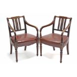 A pair of late regency carver chairs, the pierced backs inset yew-wood panel to the top-rail, with