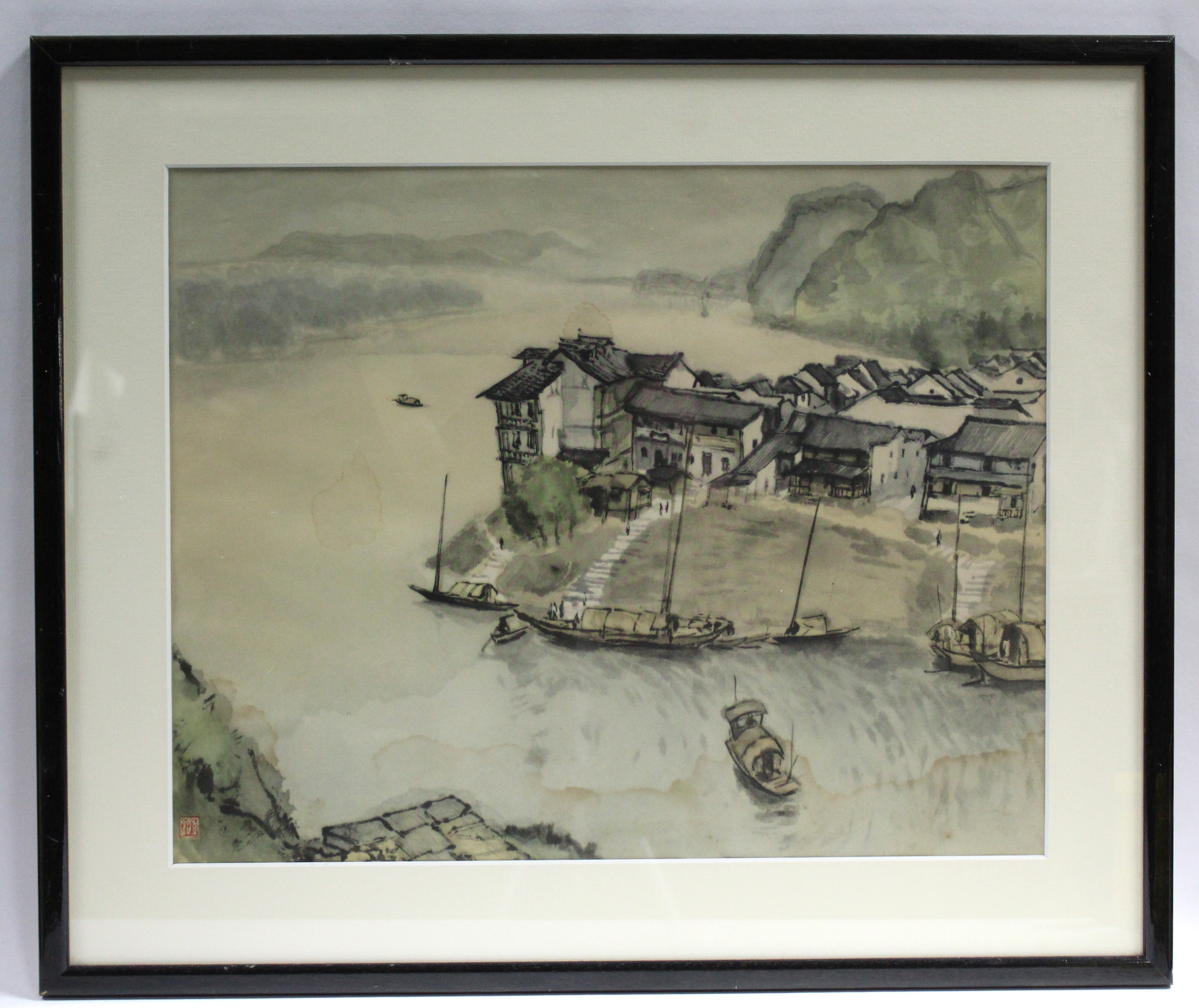 CHINESE SCHOOL, early 20th century. A coastal landscape with fishing vessels, buildings & figures to