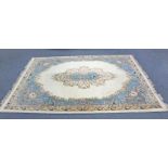 An Indian Aubusson style carpet of cream ground with central medallion & wide floral border, 12’ x