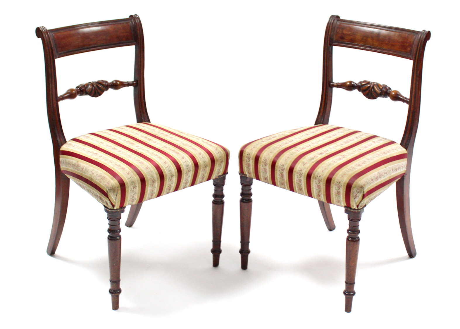 A pair of Regency-style mahogany bow-back dining chairs with padded seats & turned tapering legs.