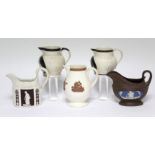 A TURNER straight-sided milk jug of serpentine outline, with classical figures within chocolate-