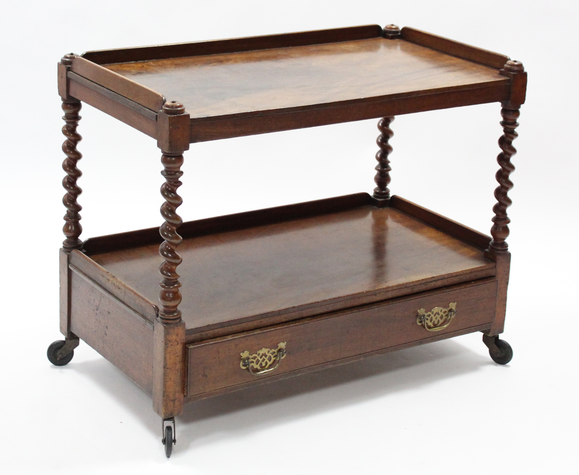 A 19th century mahogany two-tier dumb waiter fitted frieze drawer with pierced brass swing