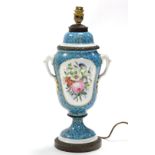 A late 19th century French porcelain two-handled vase, with painted floral panels to each side
