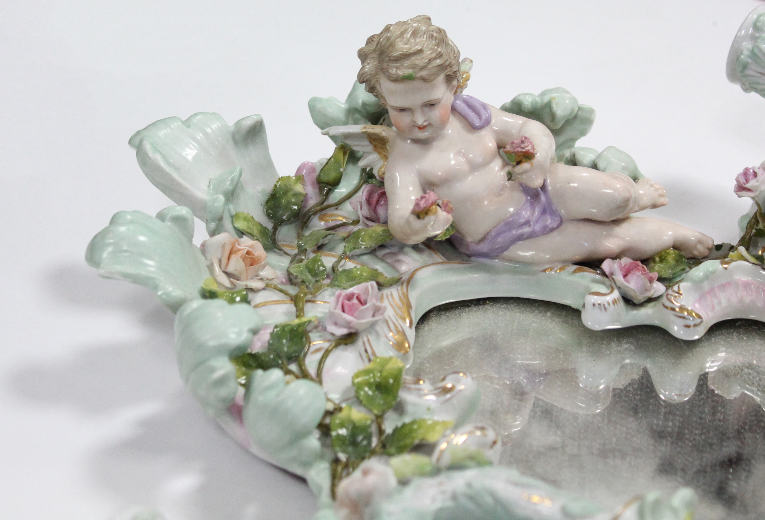 A 19th century Dresden porcelain shaped oval girandole with cherub surmount, all over floral - Image 4 of 6