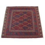 A Kazak rug of crimson & deep blue ground, with central geometric design within multiple borders; 4’