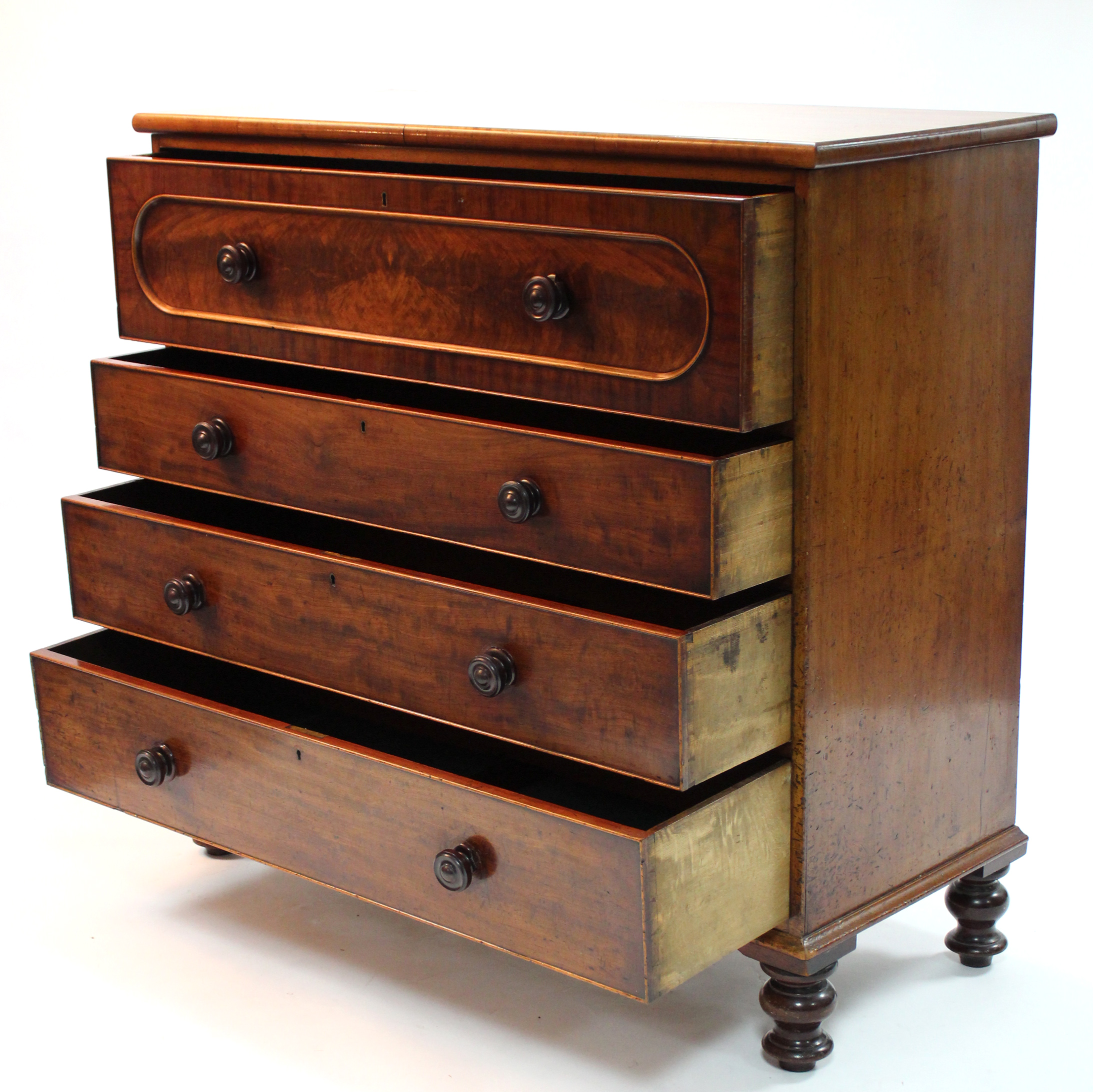 A mid-Victorian figured mahogany chest of four long graduated drawers with turned wooden - Image 2 of 4