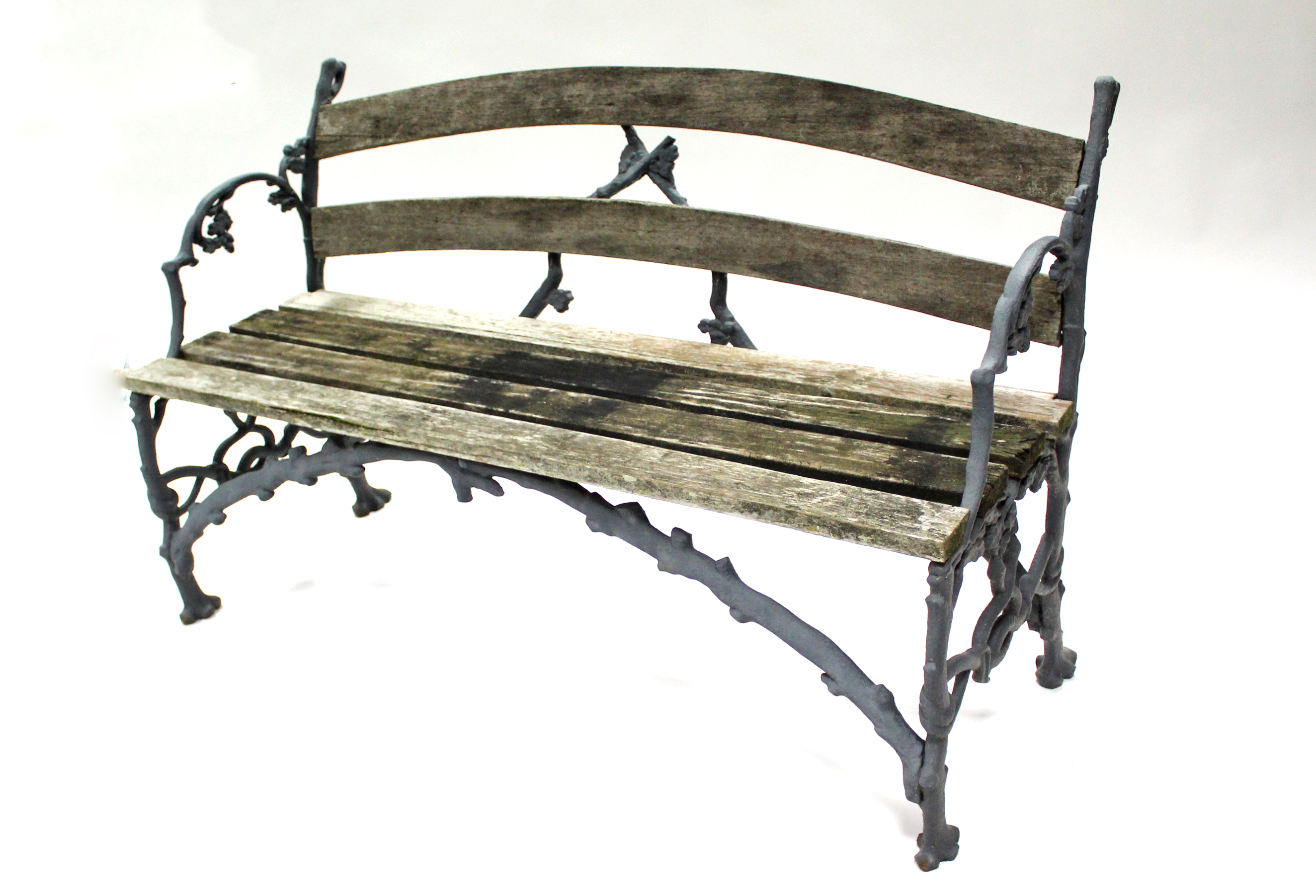 A Victorian Coalbrookdale-type cast iron & wood-slat garden bench formed as oak branches with leaves