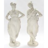 A pair of 19th century plaster standing classical female figures, each on flat circular base;