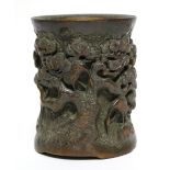 A Chinese bamboo brush pot, deeply carved with crane amongst pine trees; 5½” high.