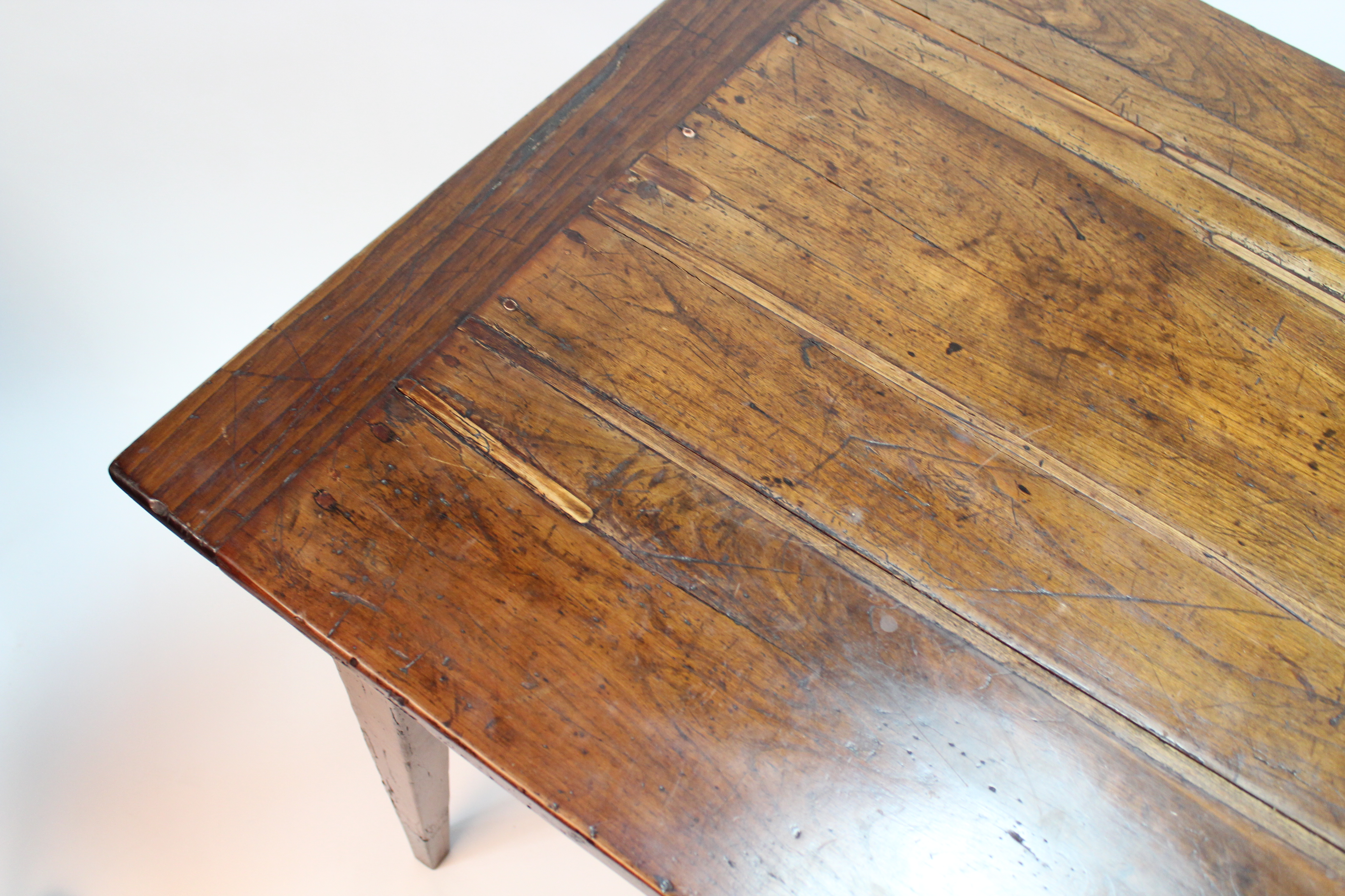 An antique French chestnut dining table, the rectangular top with cleated ends, fitted frieze drawer - Image 5 of 5