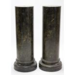 A pair of dark green scagiola columns; 12” diam x 42” high.