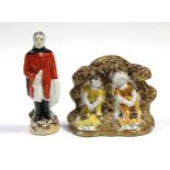 A late 18th/early 19th century Pratt-ware group of two children asleep beneath an arbour, 4” high; &