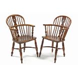 A 19th century yew-wood & elm Windsor elbow chair, with pierced splat to the hooped spindle back, on