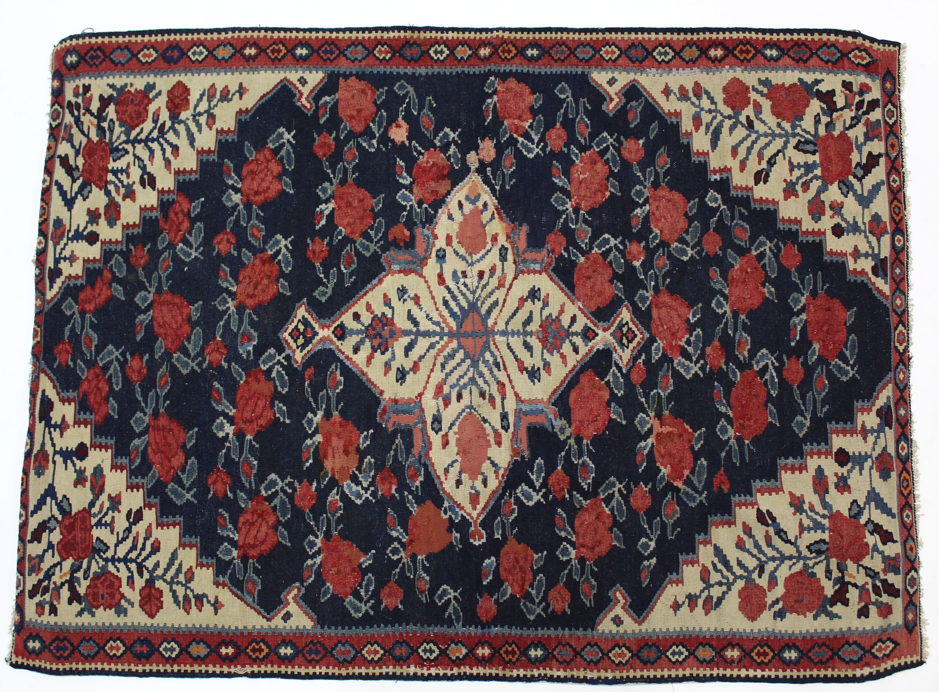 A Persian Kelim wall hanging of deep blue, crimson, & ivory ground, with central medallion