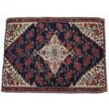 A Persian Kelim wall hanging of deep blue, crimson, & ivory ground, with central medallion