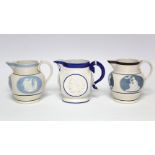 Two bulbous jugs with chocolate-brown rims & applied classical figures within pale blue-ground