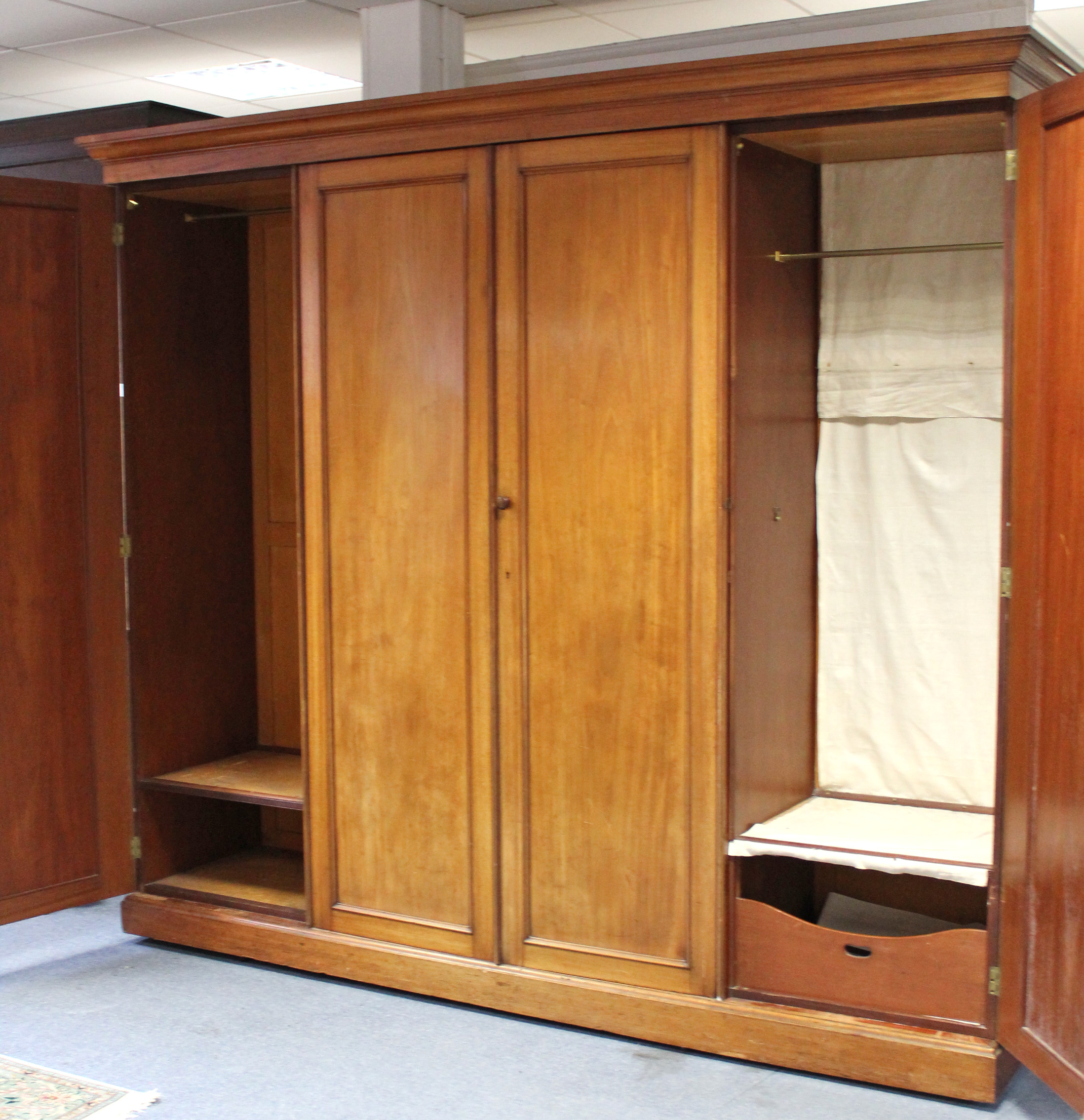 AN EARLY VICTORIAN MAHOGANY WARDROBE, the centre fitted four sliding trays above two short & two - Image 4 of 4