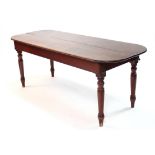 A Victorian mahogany rectangular portable serving table with rounded corners, on turned tapering