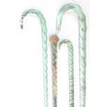 A Victorian glass spiral-twist walking cane filled with tiny multi-coloured beads, 28½” long; a pale