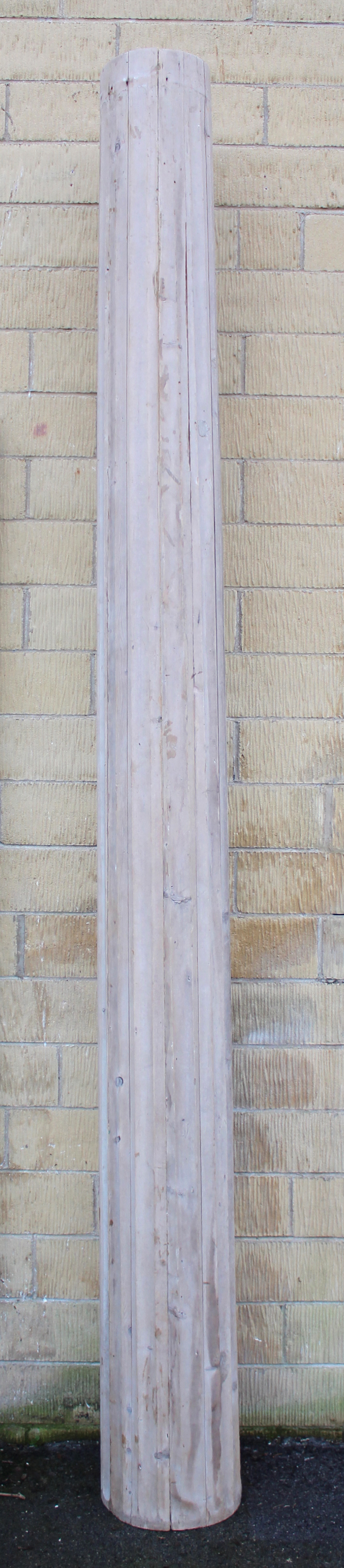 A large antique pine fluted cylindrical architectural column; 10’ 4” high.