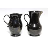 An 18th century Jackfield black-glazed large baluster jug with sparrow beak & loop handle, 9¾” high;