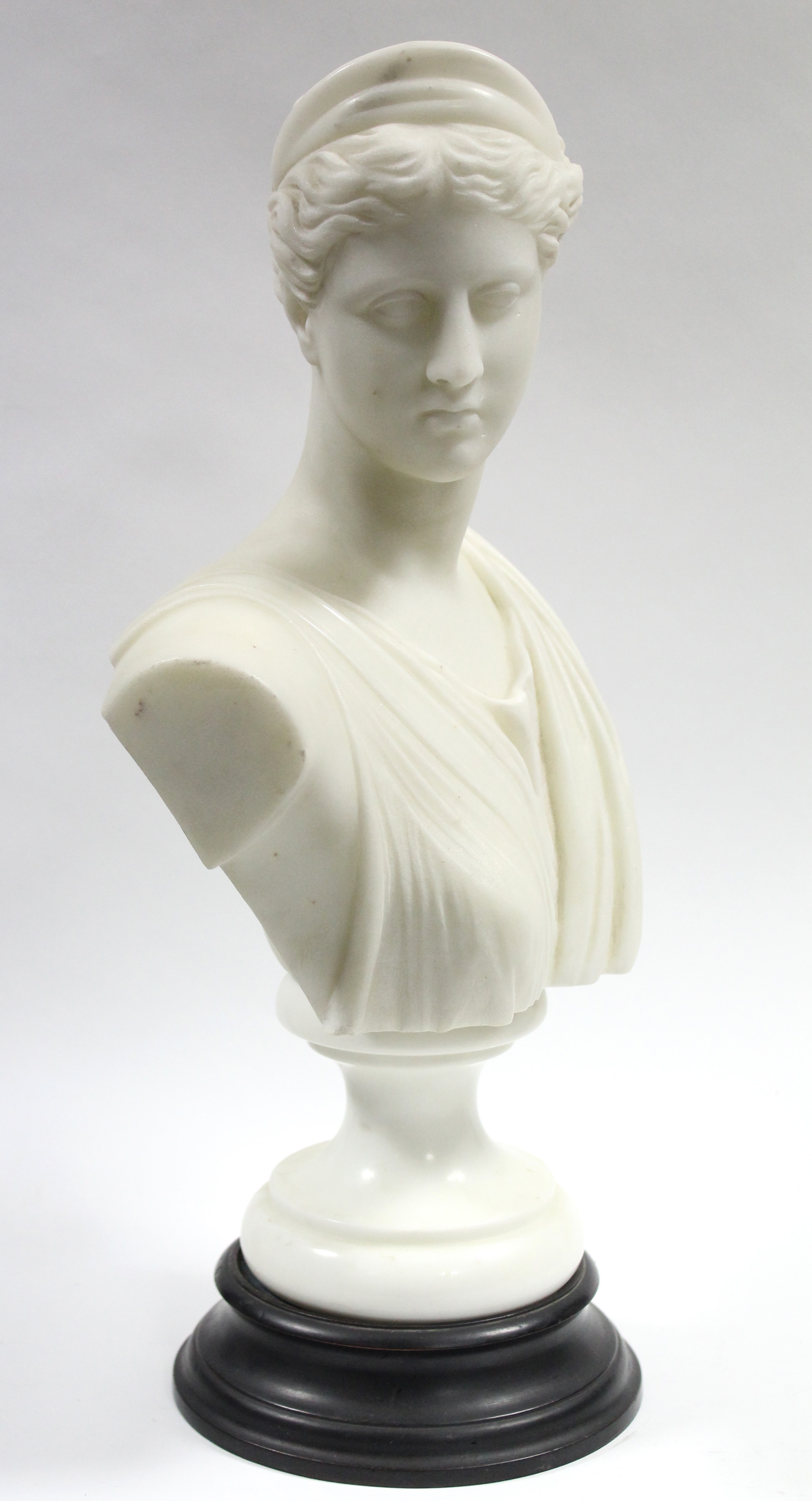 A late 19th century white marble classical female bust, on turned socle; 17” high. - Image 2 of 3