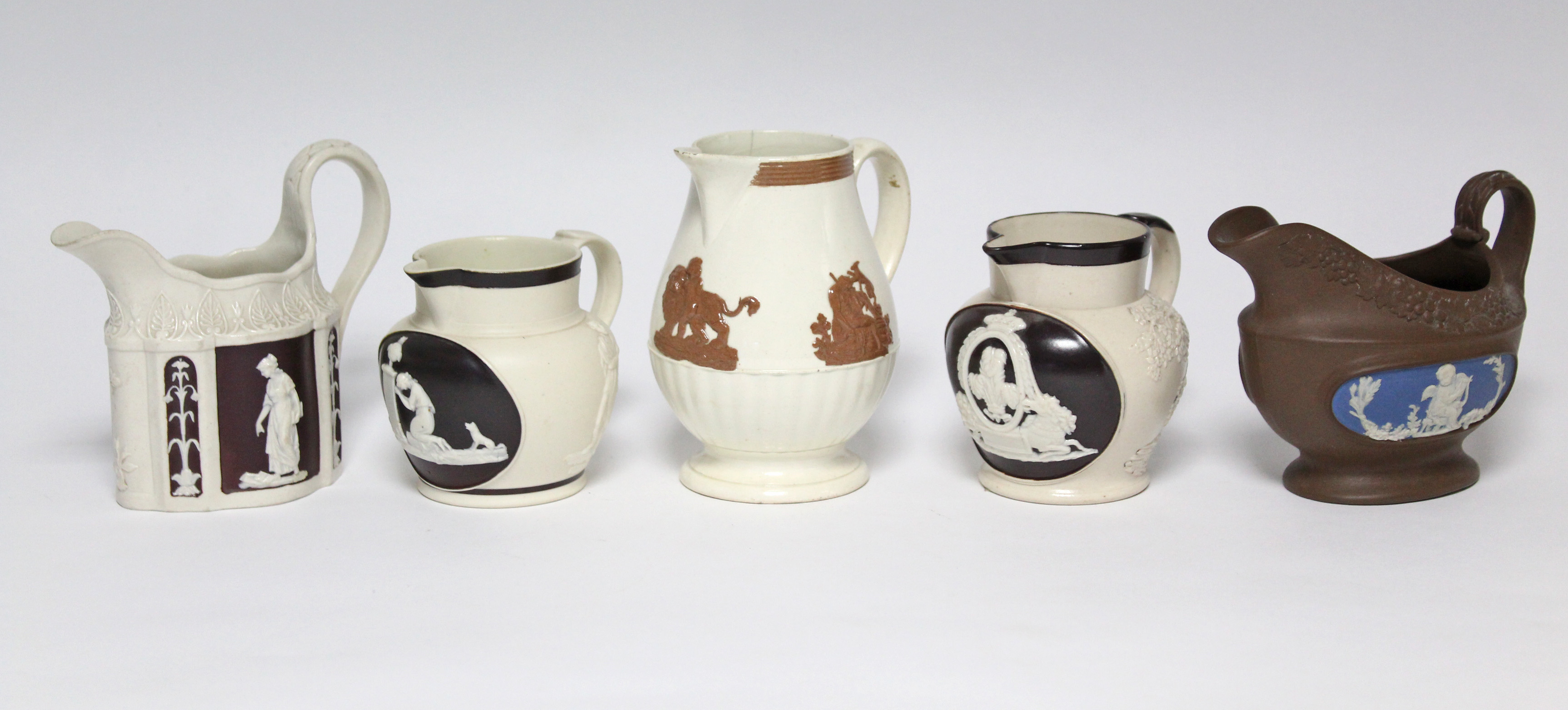 A TURNER straight-sided milk jug of serpentine outline, with classical figures within chocolate- - Image 2 of 2