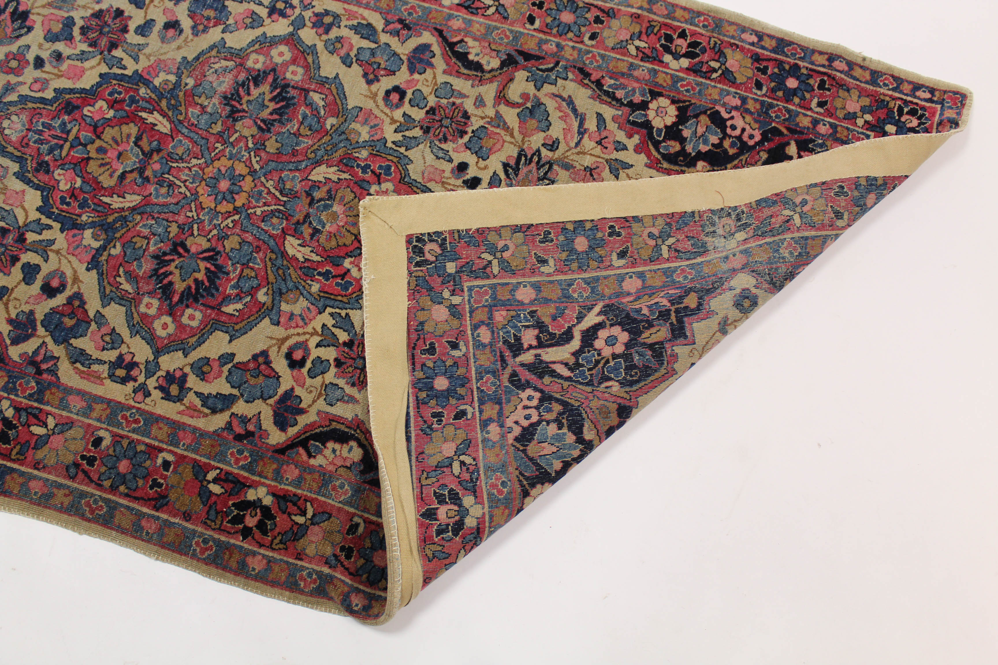 A Persian rug of dark blue ground, with central medallion surrounded by floral spandrels within - Image 2 of 2