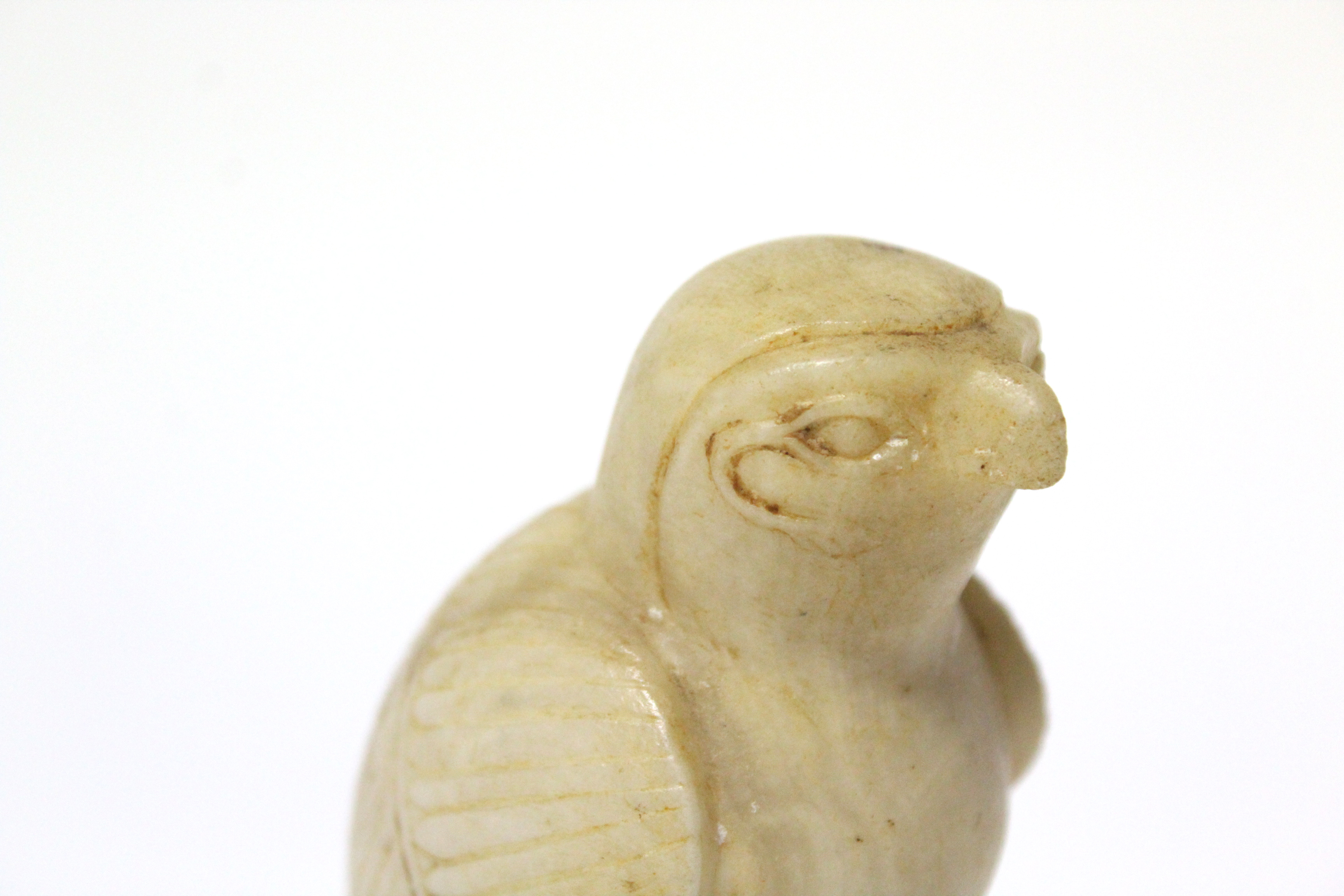 An Egyptian carved alabaster figure of Horus, on narrow rectangular base; 5” high. (Damage to - Image 4 of 5