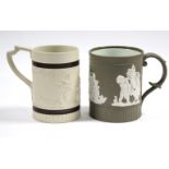 A cylindrical buff-ground tankard by TURNER, with relief decoration of archers in a landscape,