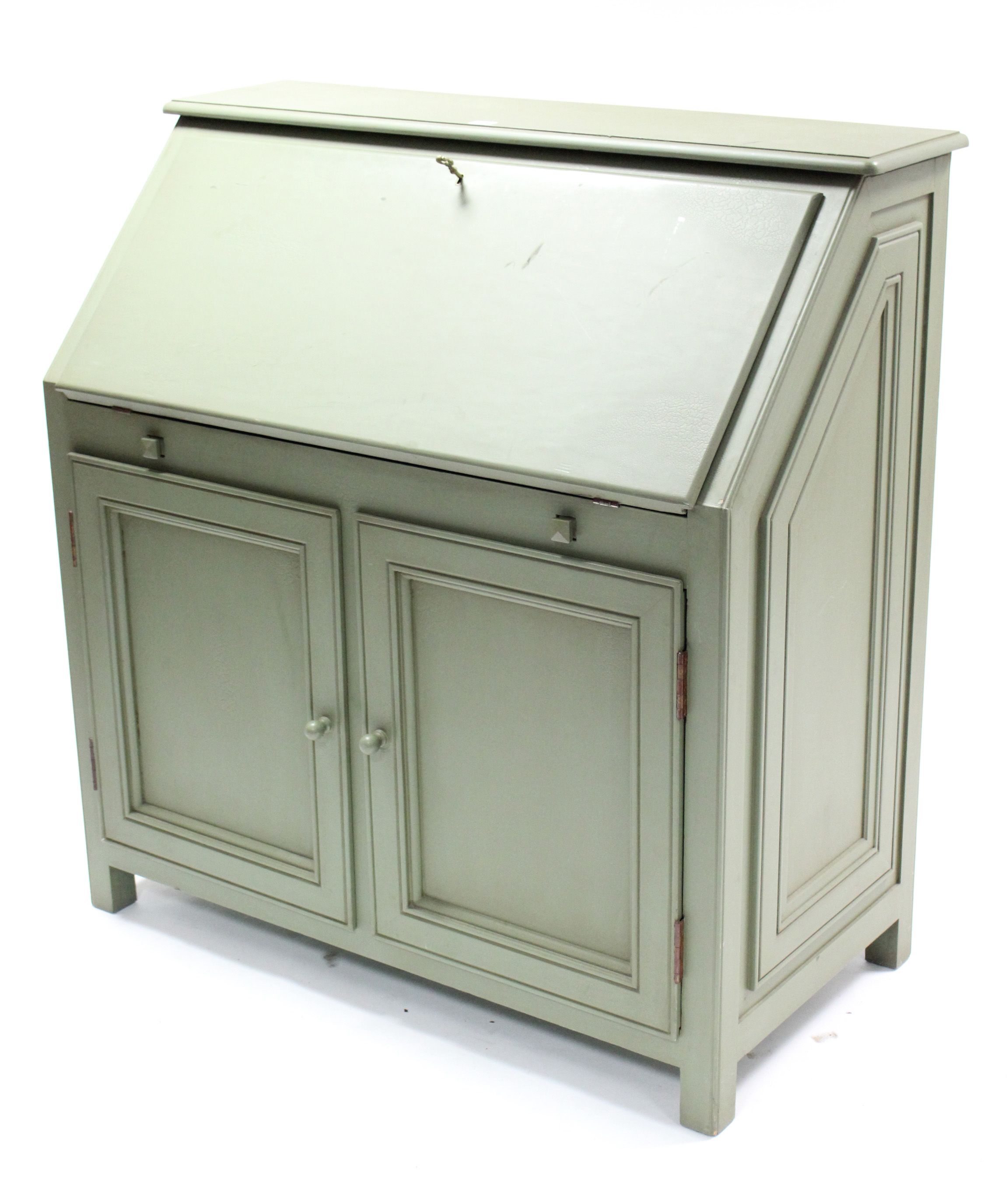 A continental-style green painted wooden bureau, with fitted interior enclosed by fall-front above