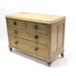 A Victorian pine dwarf chest, fitted two short & two long graduated drawers with turned knob