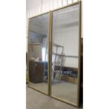A LARGE PAIR OF RECTANGULAR WALL MIRRORS IN GILT FLUTED FRAMES, 34" x 91" & 39½” x 91”.