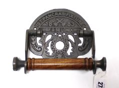 A reproduction cast-iron toilet roll holder “ST PANCRAS FIXTURE WBF & SL LONDON”, 7¾” wide.