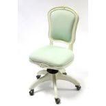 A continental-style white painted wooden frame revolving desk chair on five splay legs with