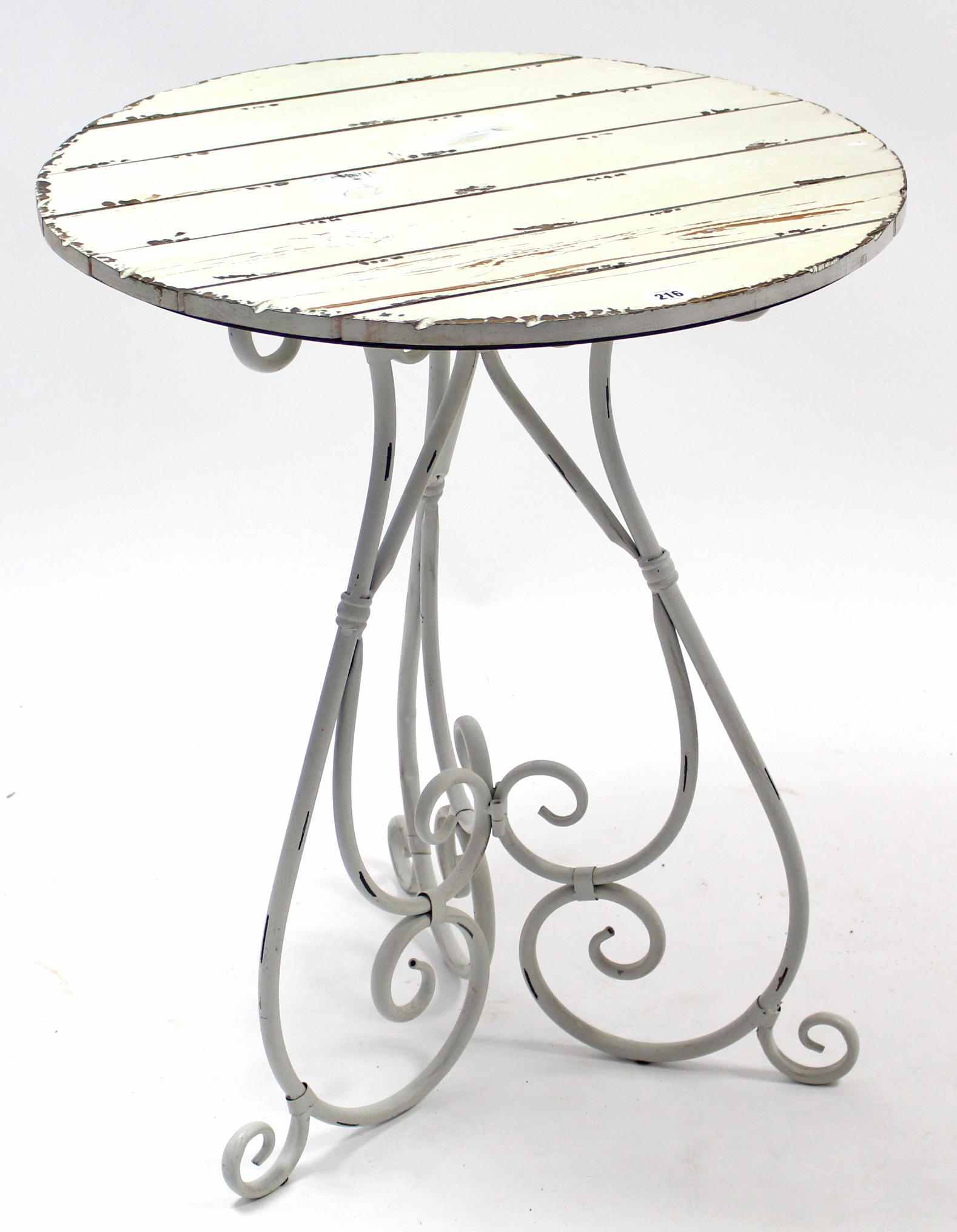 A white painted wrought-metal garden table, on three scroll supports & with white painted wooden