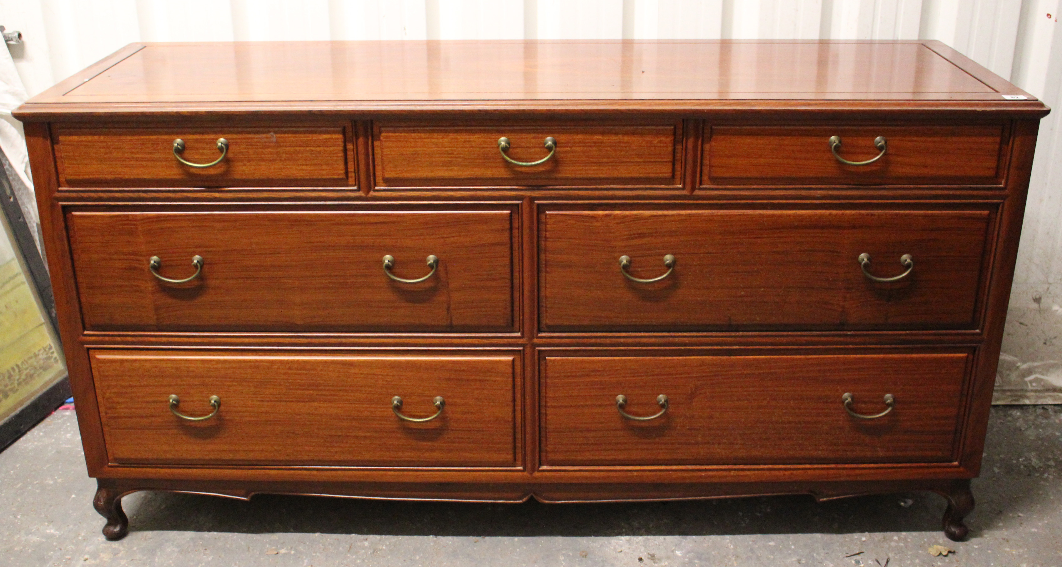 Another oriental-style rosewood-finish sideboard fitted three frieze drawers above two ranks of