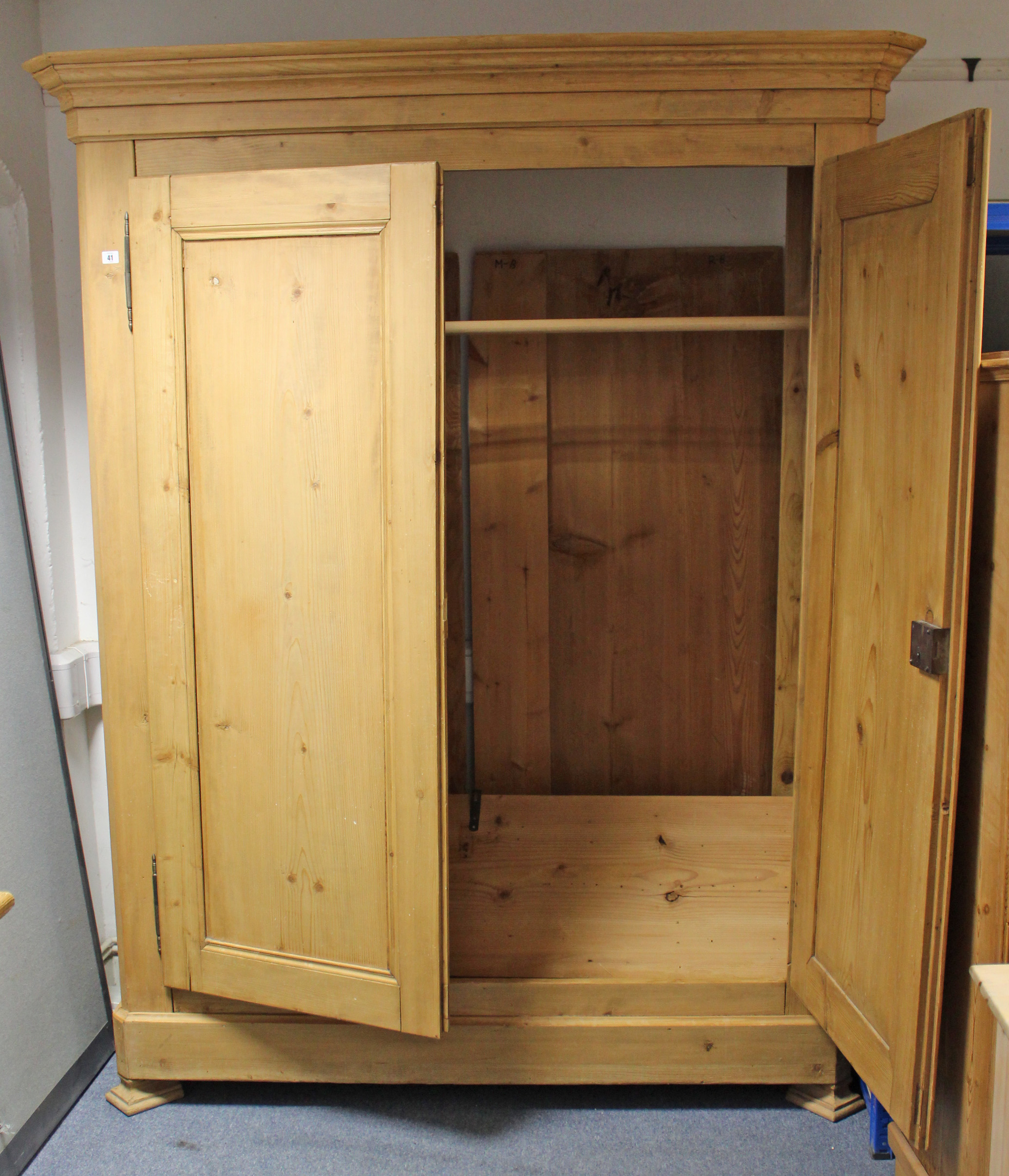 A 19TH CENTURY FRENCH PINE WARDROBE with moulded cornice, enclosed by pair of panel doors, & on - Image 2 of 2