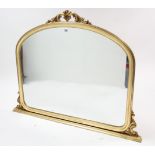 A reproduction gilt frame overmantel mirror with scroll surmount, 55½” wide x 43¾” high.