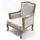 A continental-style beech frame armchair with shaped back, & loose cushion to seat upholstered cream