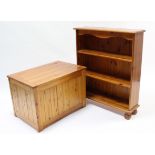 A pine small four-tier open bookcase on turned feet, 33” wide; & a pine toy box with hinged lift-