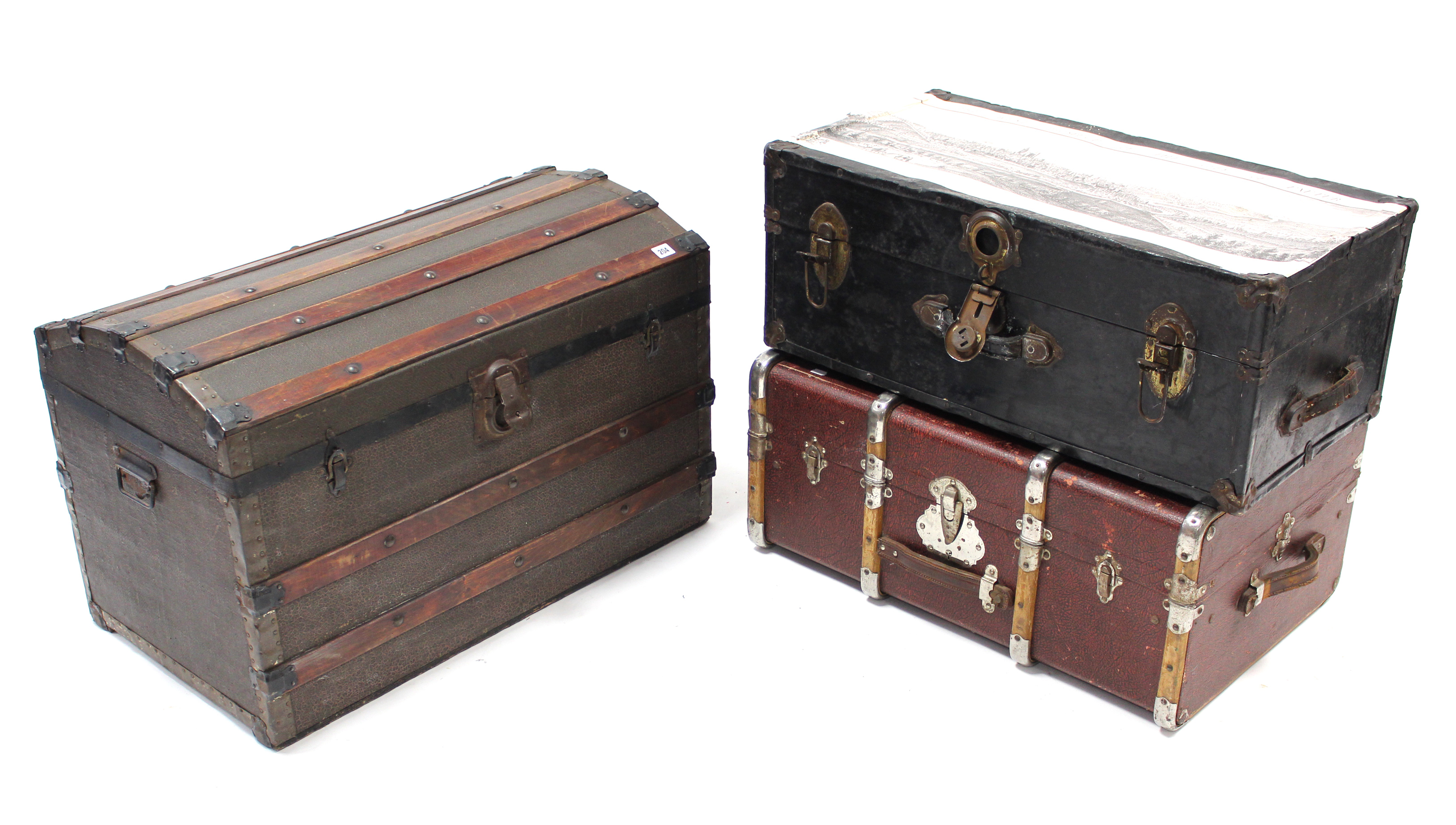 A ribbed domed-top travelling trunk with hinged lift-lid & wrought iron side handles, 33” wide;