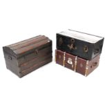 A ribbed domed-top travelling trunk with hinged lift-lid & wrought iron side handles, 33” wide;