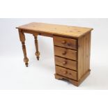 A pine dressing table, fitted four long drawers to the right-hand side, & with turned supports to