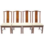 A set of six oriental-style hardwood dining chairs, each with carved geometric design to the tall