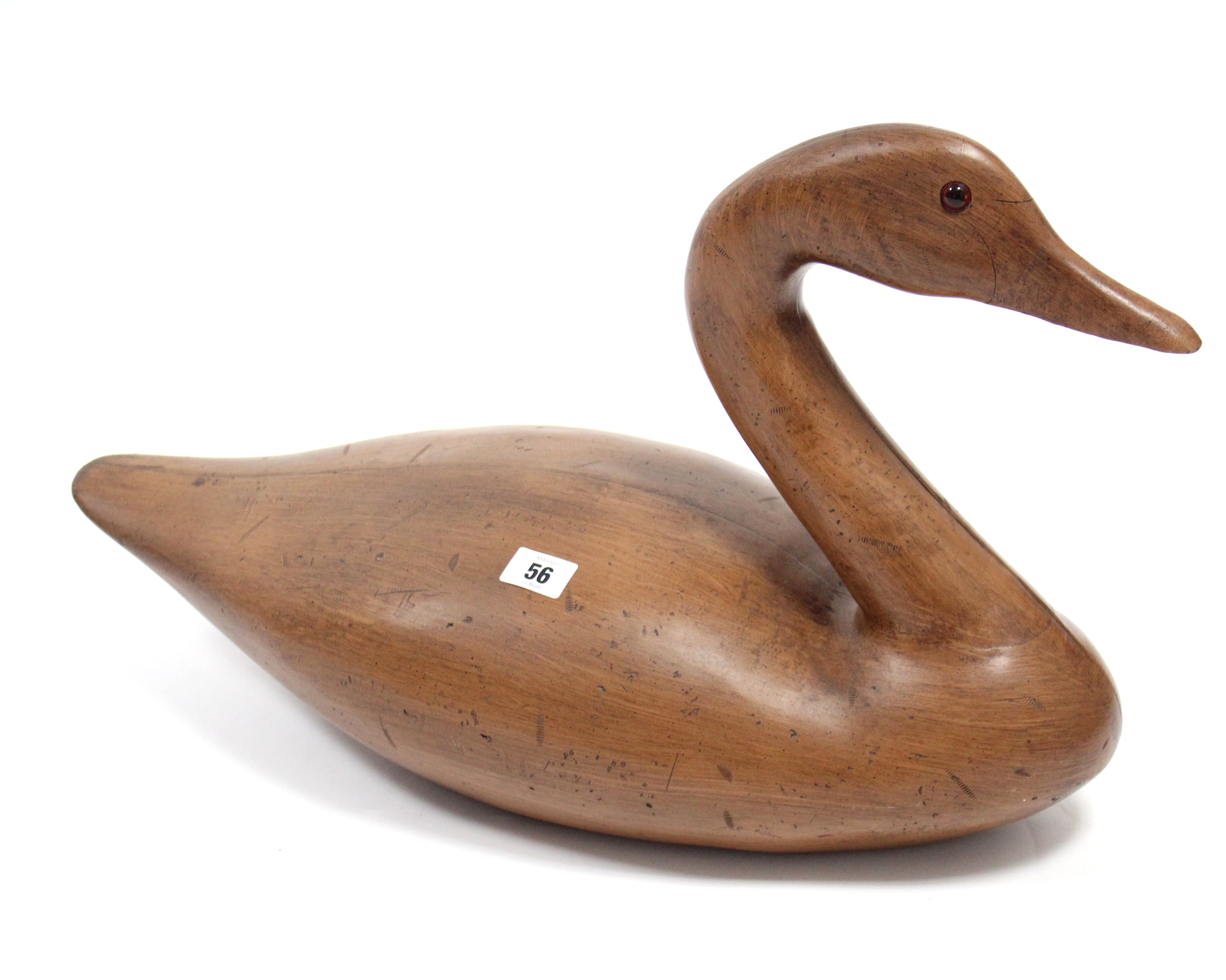 A large carved wooden goose ornament, 22” long; two trinket boxes; a brass trivet & sundry other