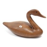 A large carved wooden goose ornament, 22” long; two trinket boxes; a brass trivet & sundry other