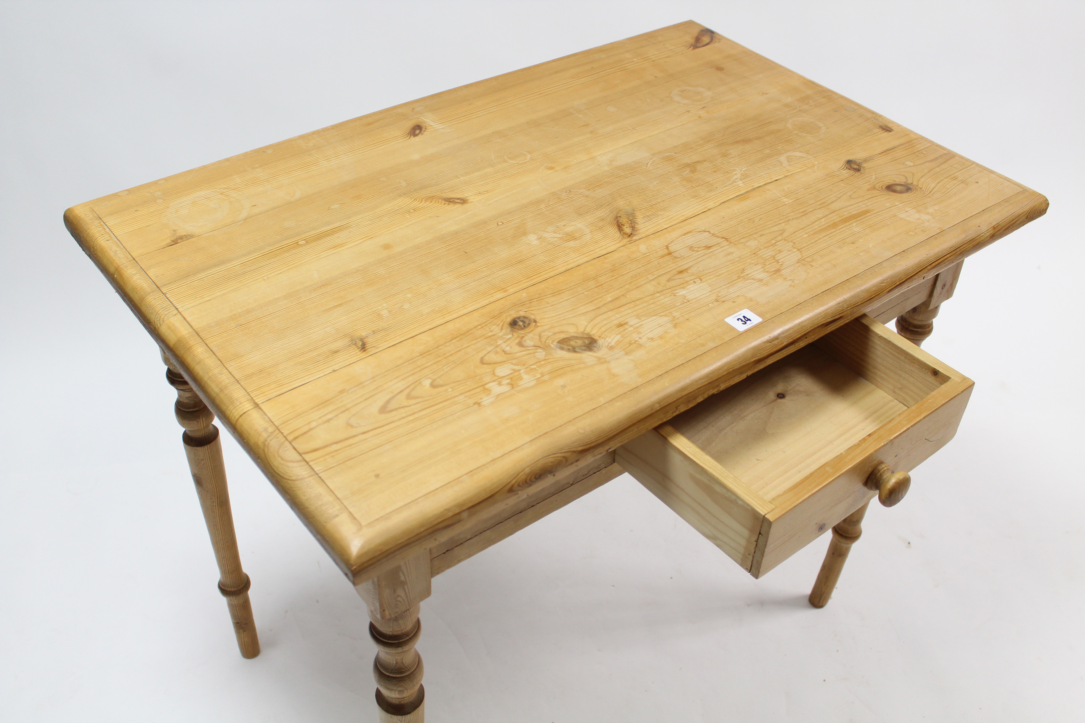 A pine side table fitted centre frieze drawer, & on turned tapered legs, 36½” wide. - Image 2 of 2