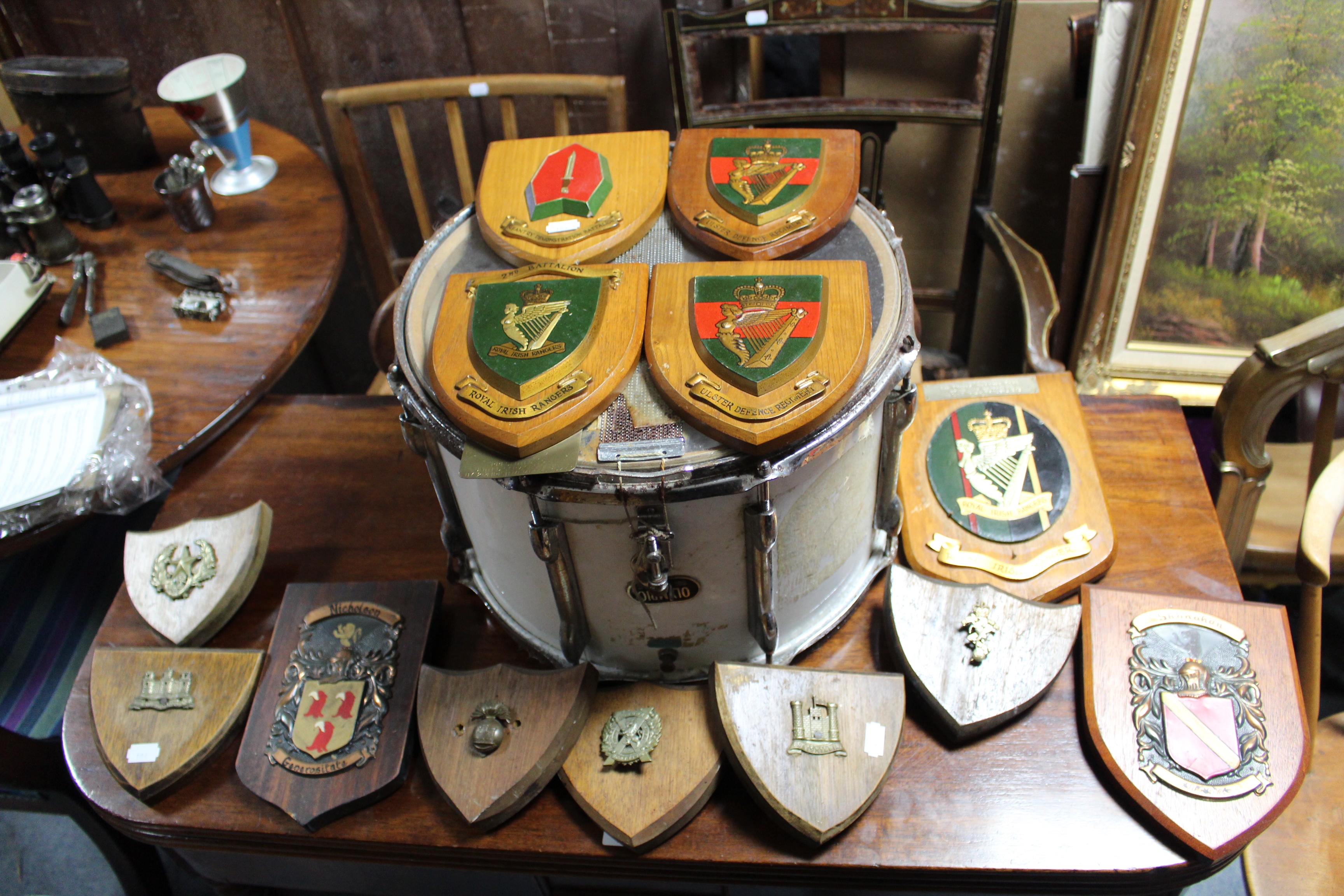 Thirteen regimental shield-shaped plaques; various military prints & documents; & a Remo snare