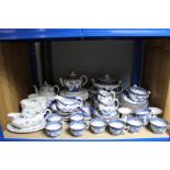 Approximately forty matched items of blue & white “Willow” pattern dinner & tea ware; & twenty-two